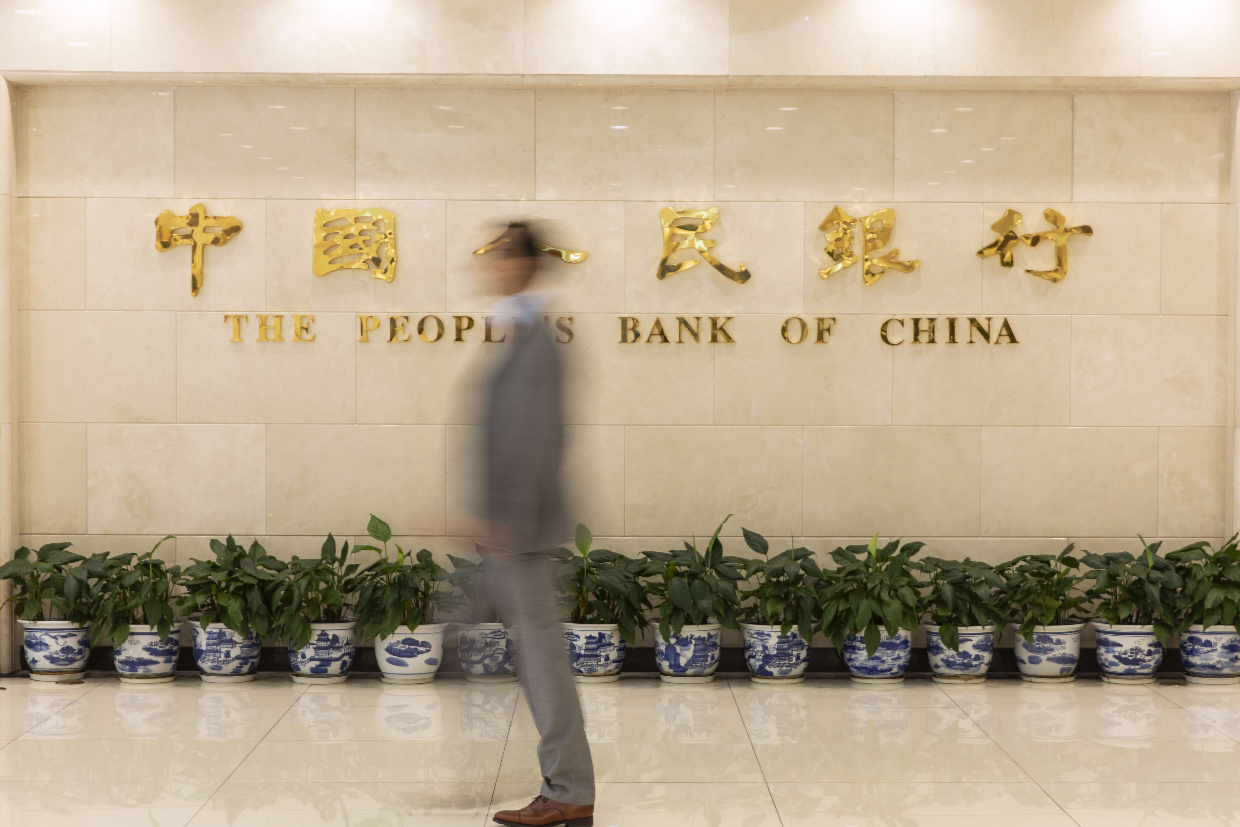 applies China Picks New Central Bank Policy Makers as it targets risk