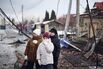 Residents near the site of an air attack in Sofiivska Borshchagivka, Kyiv region on Feb. 22.