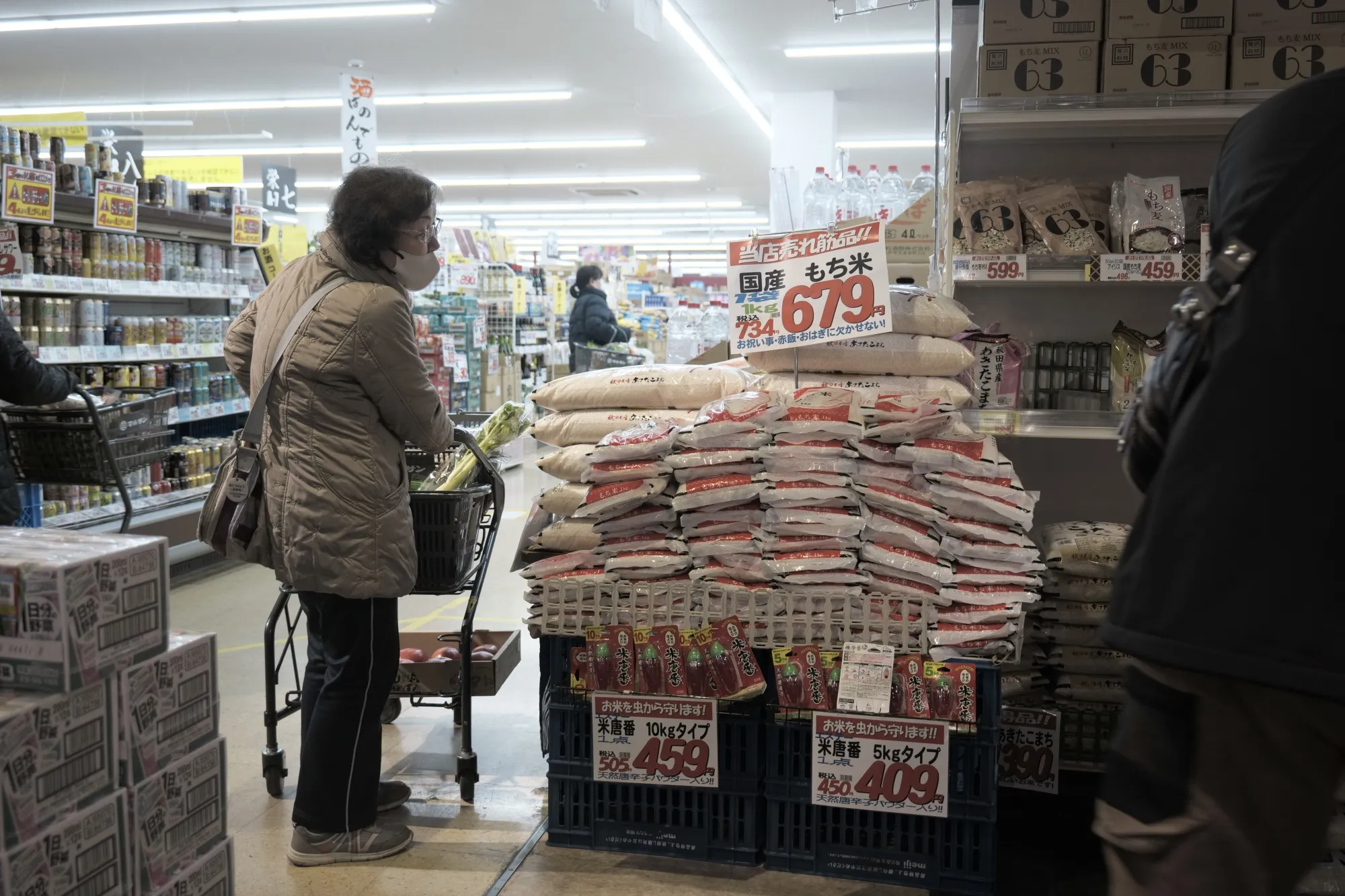 A customer shops for rice at a supermarket in Koshigaya, Japan.