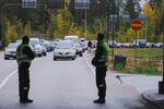 Finnish border guards look at cars queueing at the Vaalimaa border crossing between Finland and Russia on Sept. 30.