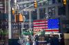 A monitor displays stock market information outside the Nasdaq MarketSite in the Times Square neighborhood of New York, U.S.