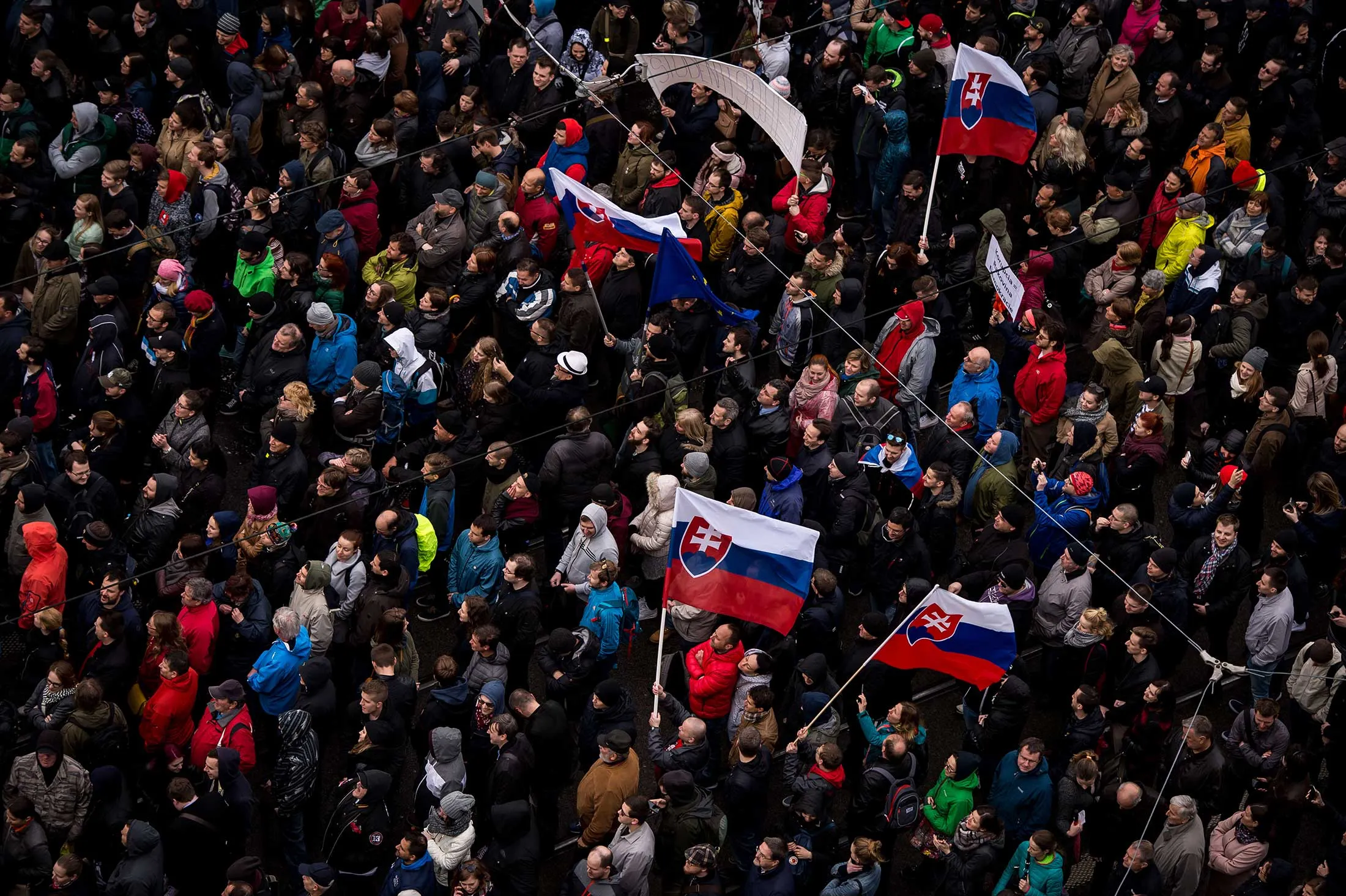 Demonstrators hold up flags of Slovakia during an anti-corruption rally in Bratislava, Slovakia, on April 18, 2017.
