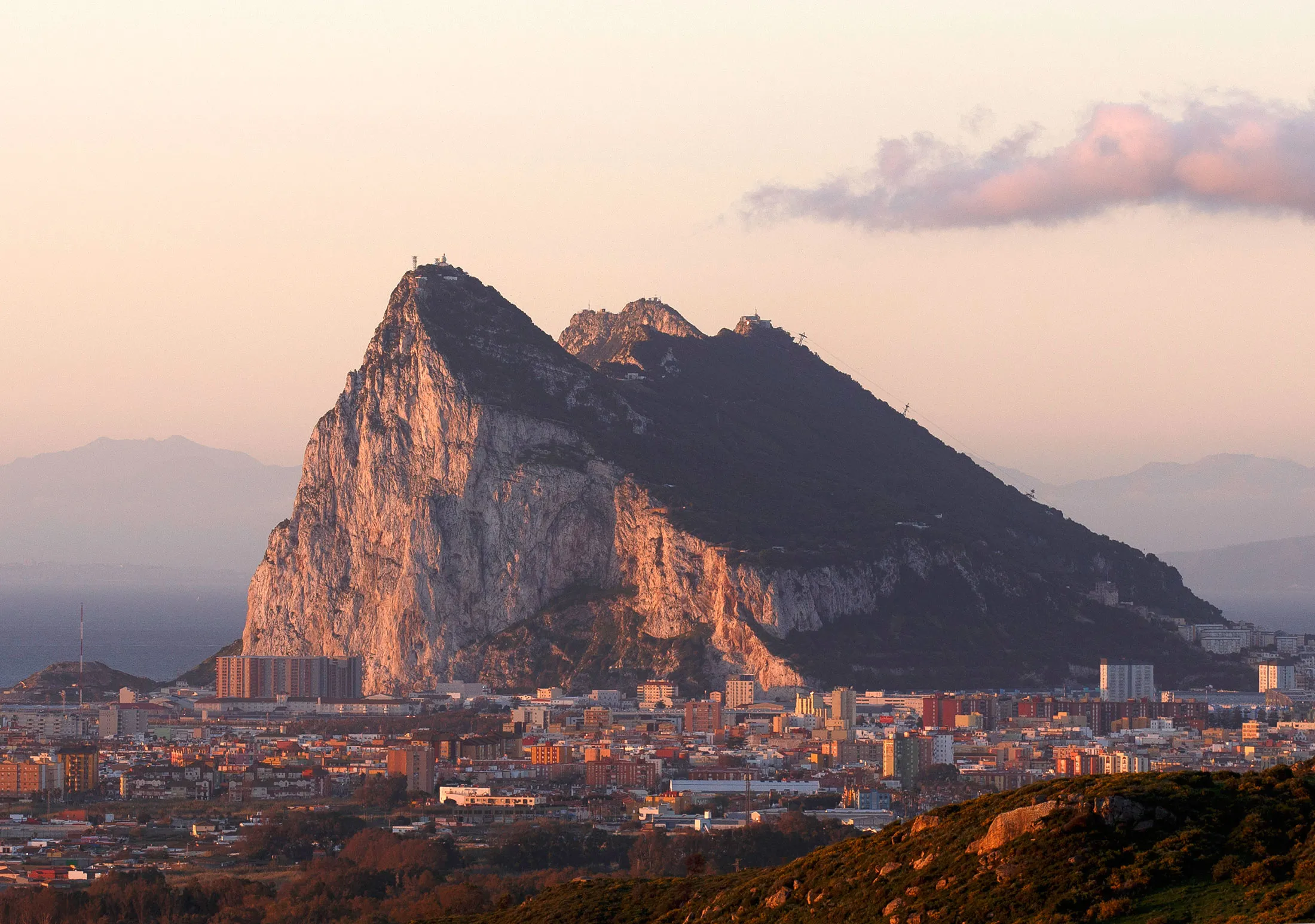 The Rock of Gibraltar stands behind La Linea de la Concepcion city.