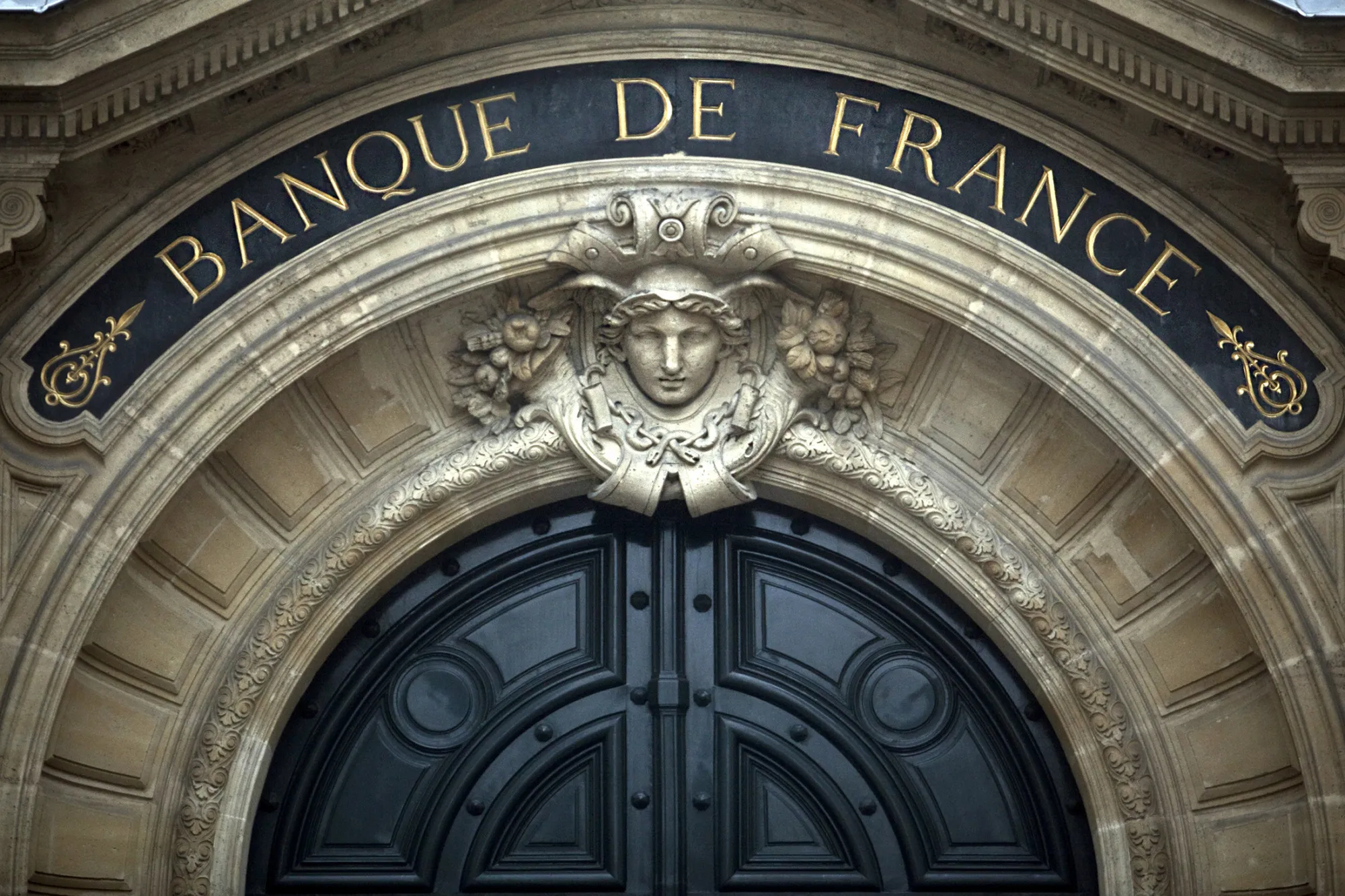 A sign for the Banque de France sits above the bank's entrance in Paris, France.