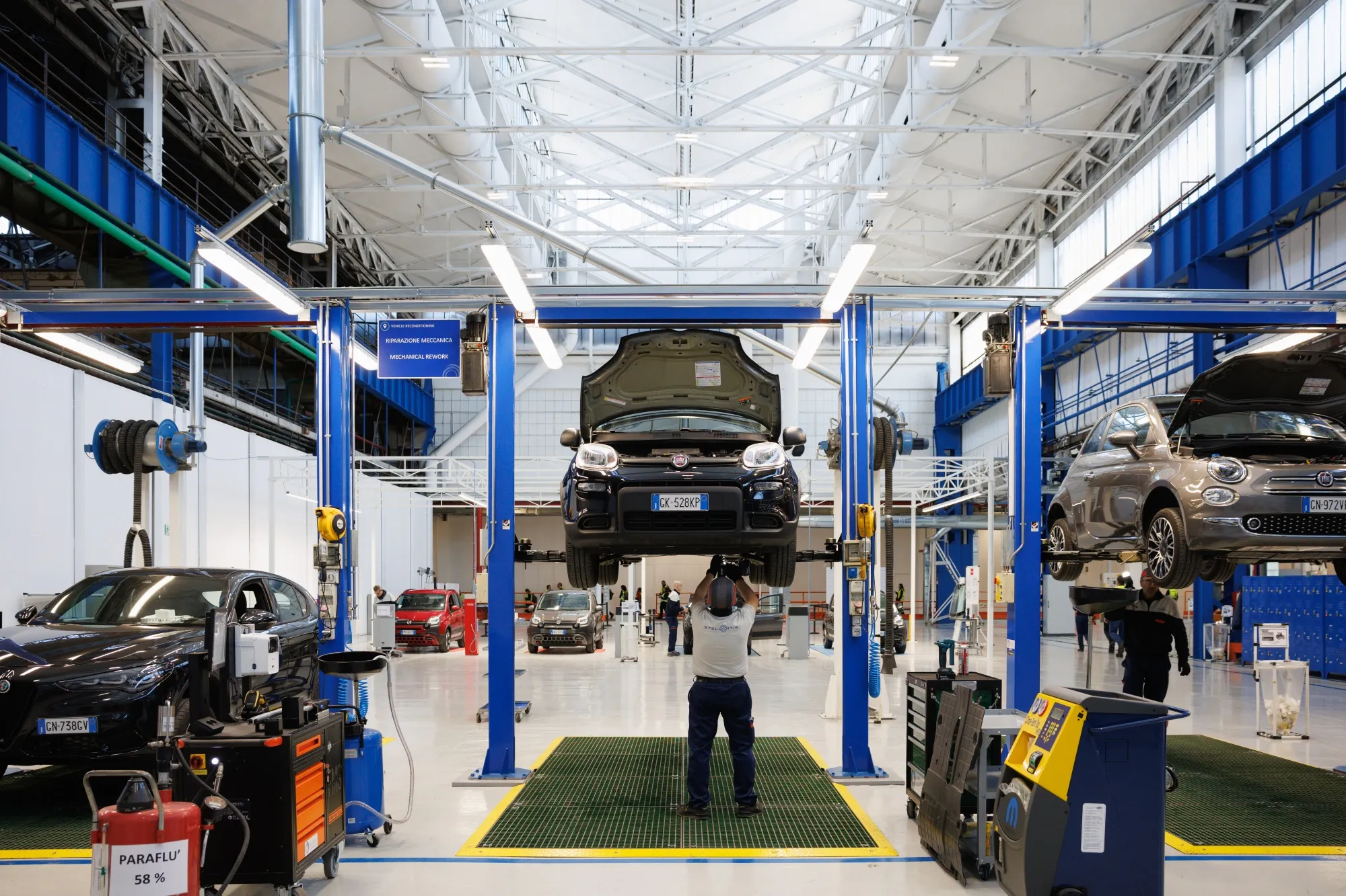 An employee works on the production floor of a Stellantis complex.