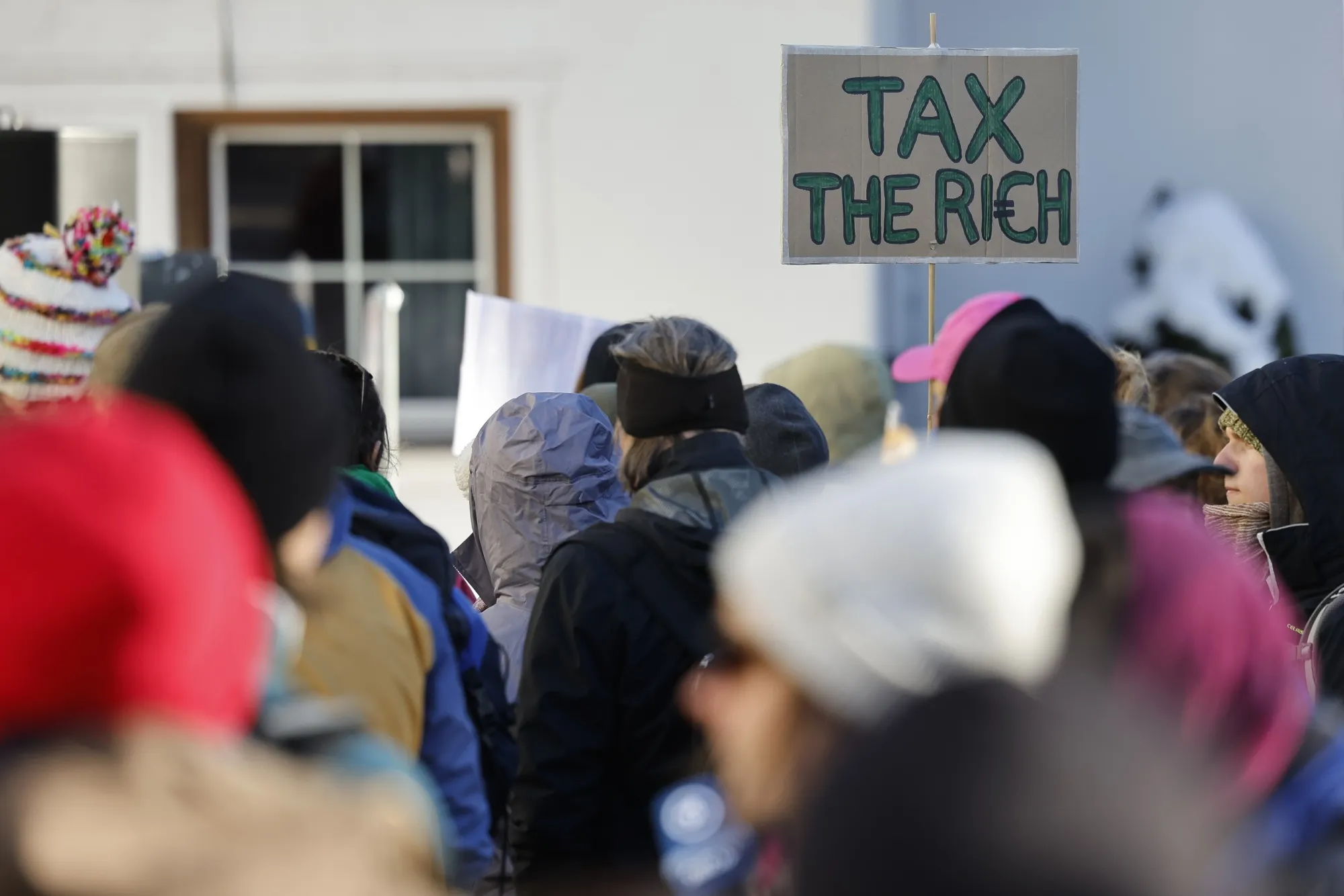 Protestors holding banners during a demonstration against the World Economic Forum&nbsp;ahead of its start in Davos, Switzerland, on Jan. 14.