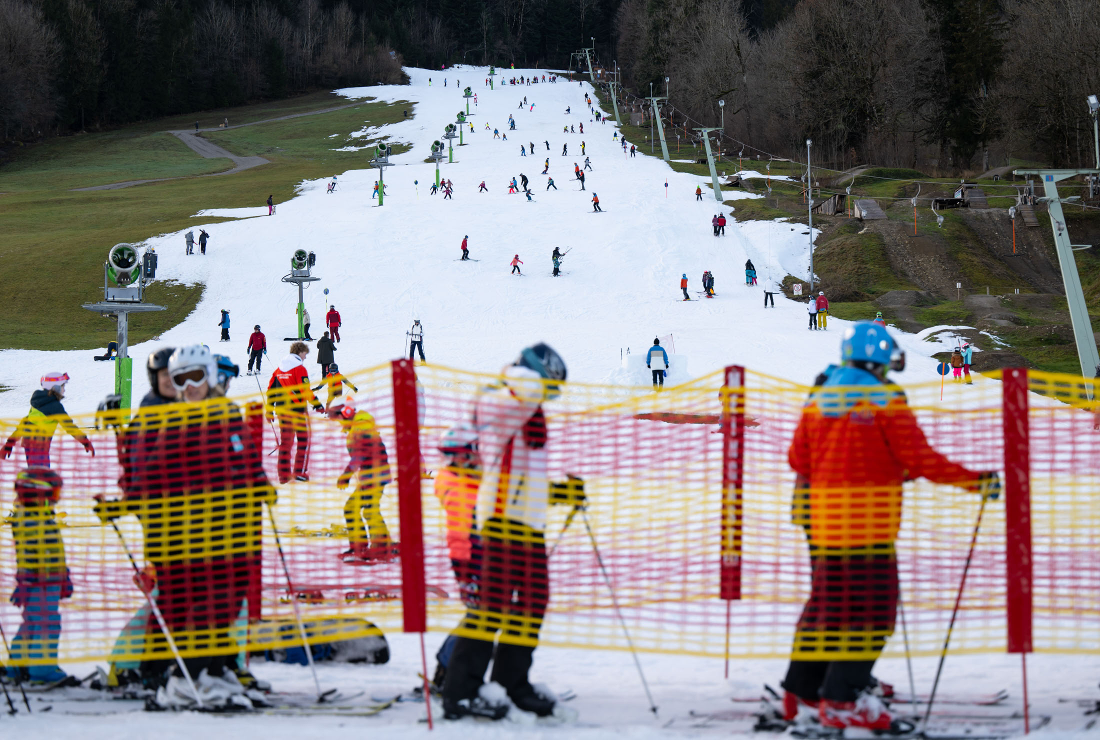 Skiers and snowboarders queue up for the&nbsp;lift at&nbsp;Brauneck mountain, on Dec. 28, in Germany, where many ski resorts are currently suffering from a lack of snowfall.&nbsp;