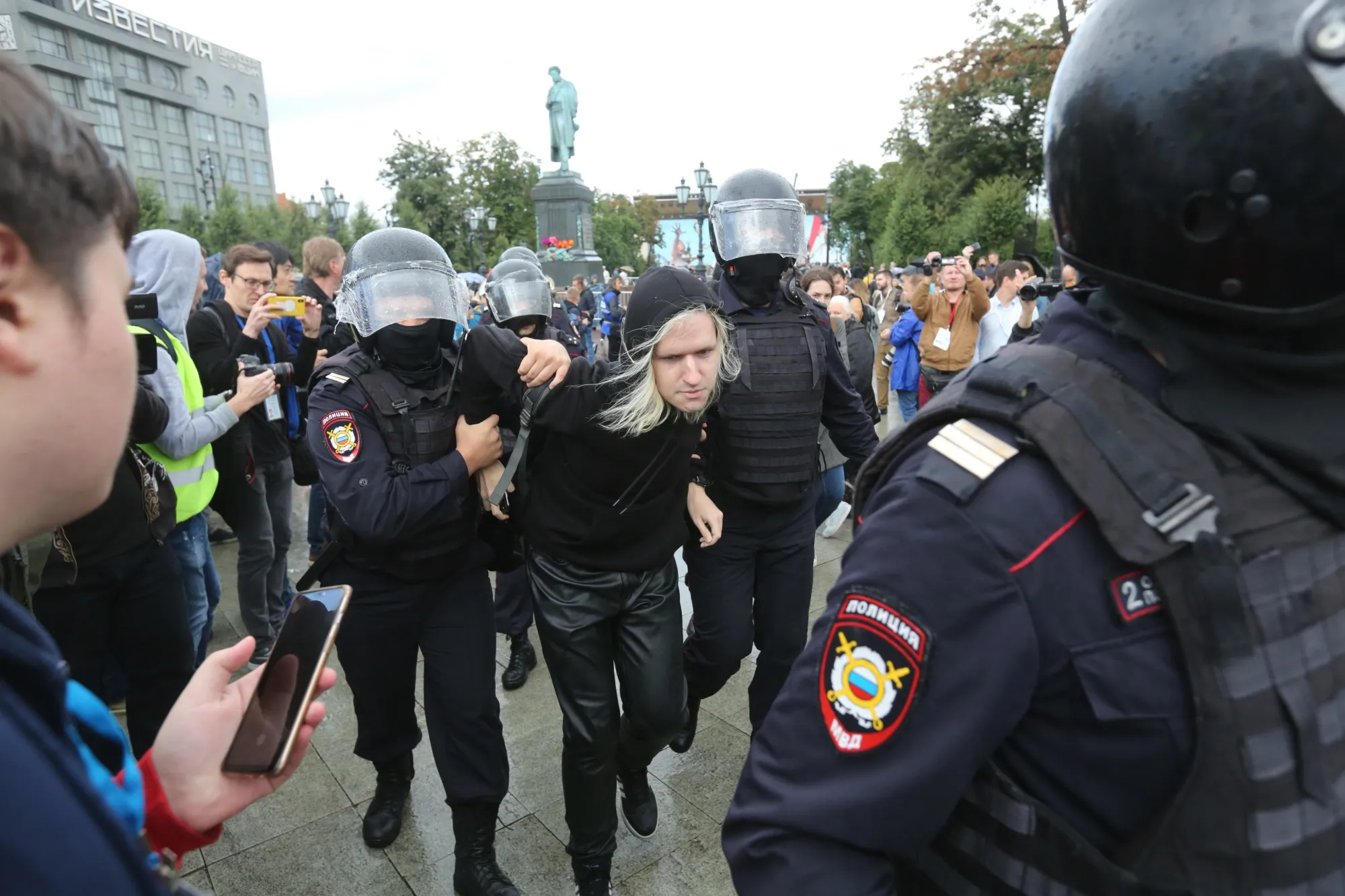 Russian police detain a demonstrator during a rally in Moscow on Aug. 3.