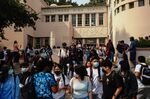 Students exit Hollywood High School after the first day of school in Los Angeles.