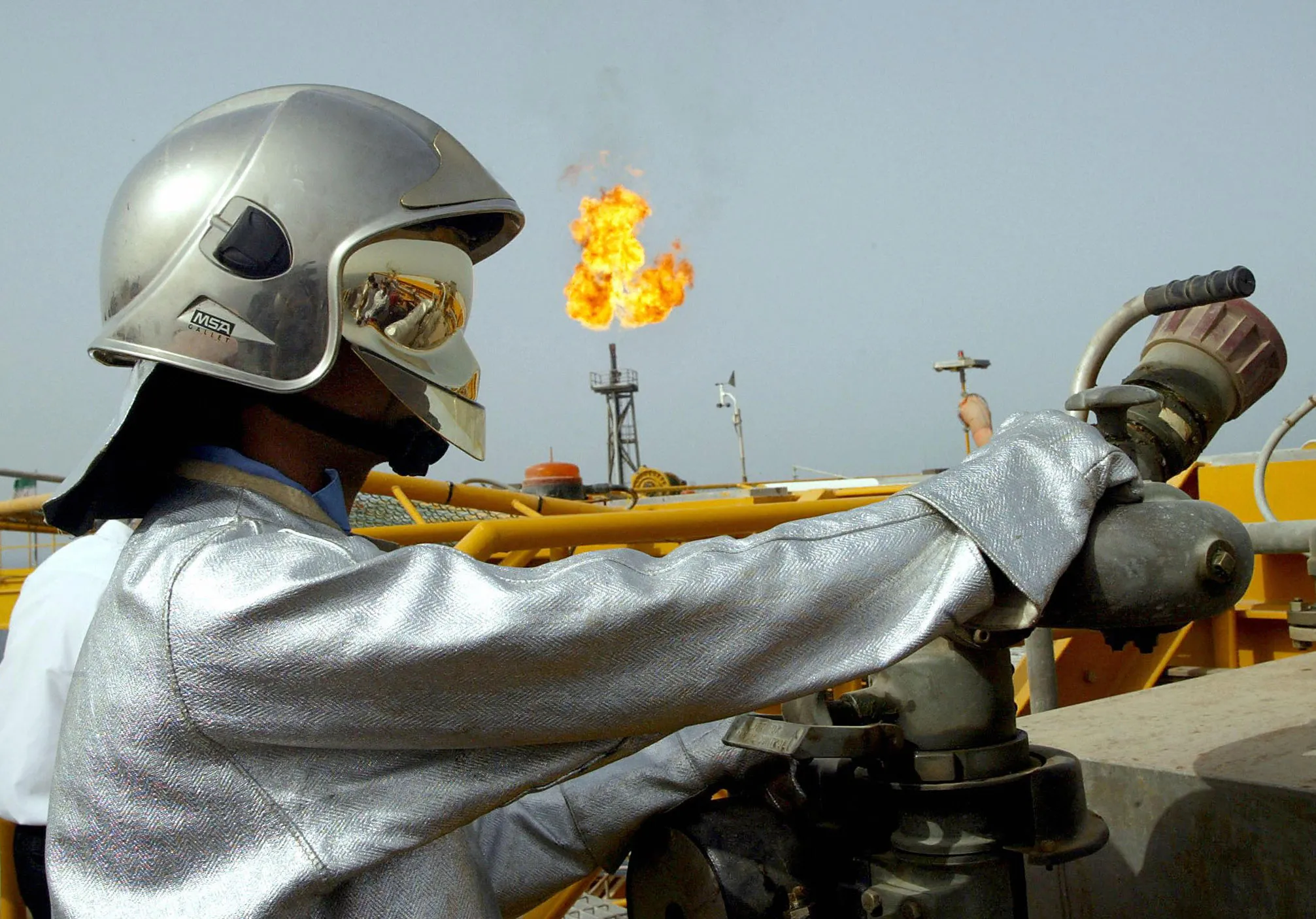 An Iranian technician works on an offshore oil platform in the Gulf waters
