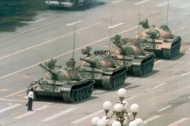 A Chinese man standing alone to block a line of tanks heading from Tiananmen Square in Beijing on June 5, 1989