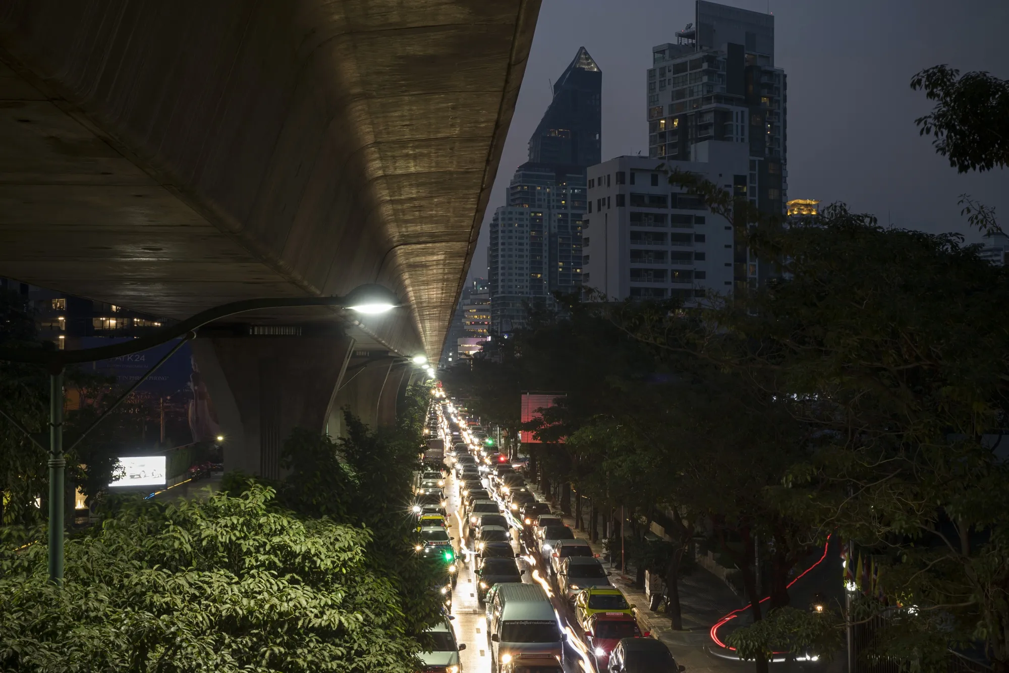 Vehicles sitting in traffic illuminate Sukhumvit Road at night in Bangkok, Thailand, on Monday, Jan. 14, 2019.
