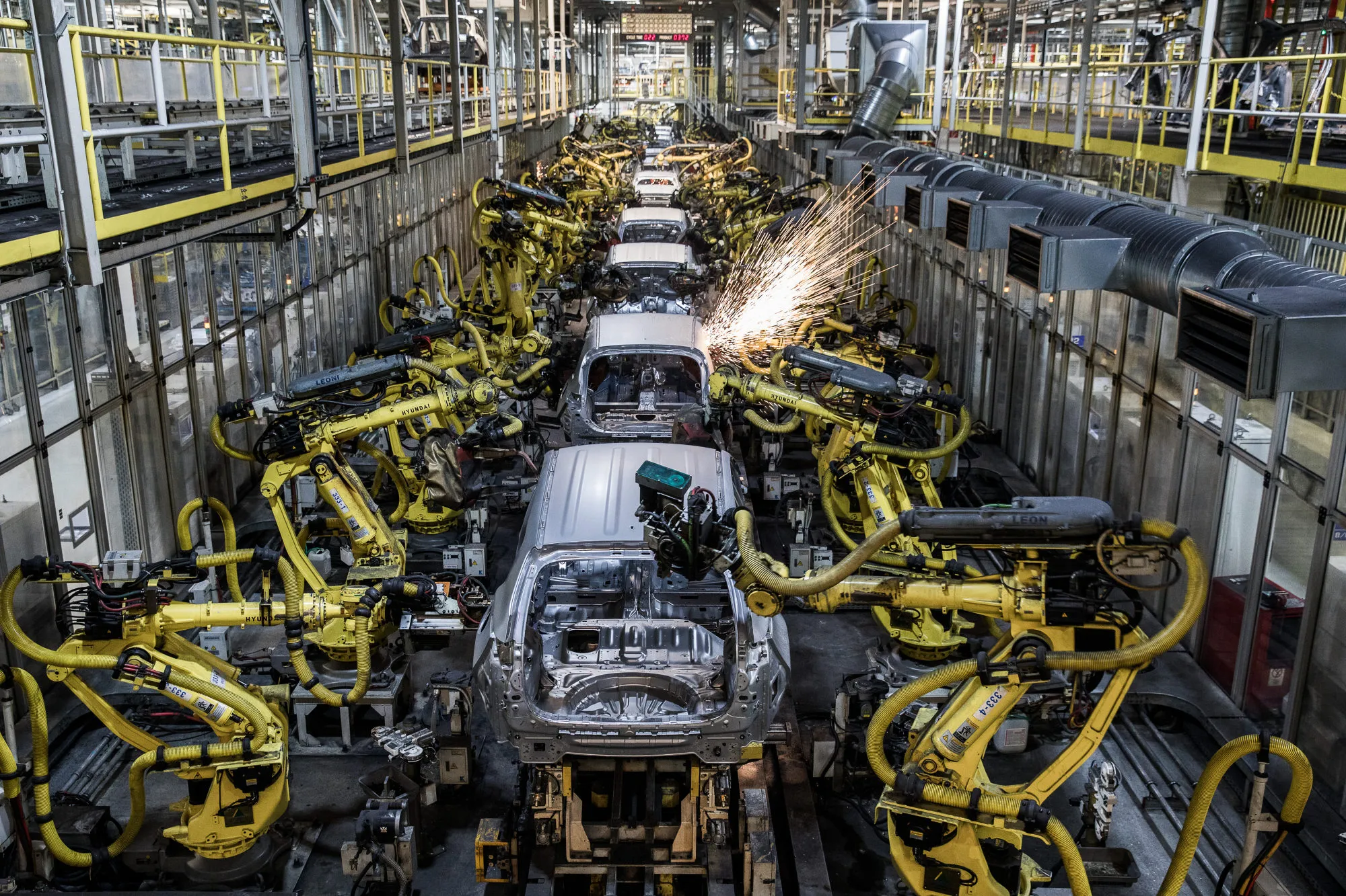 Sparks fly as robotic arms weld panels of automobiles on the production line at an auto&nbsp;plant in Zilina, Slovakia.