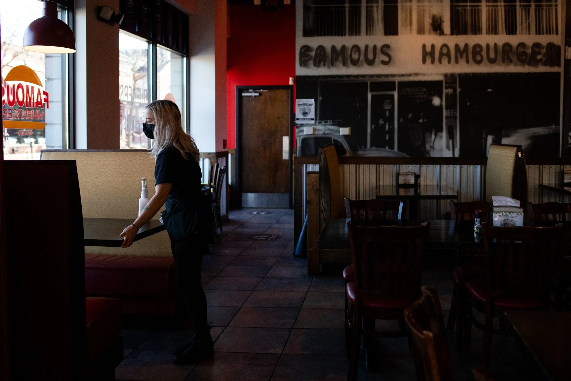 A server wipes down tables at a restaurant in Dearborn, Michigan.
