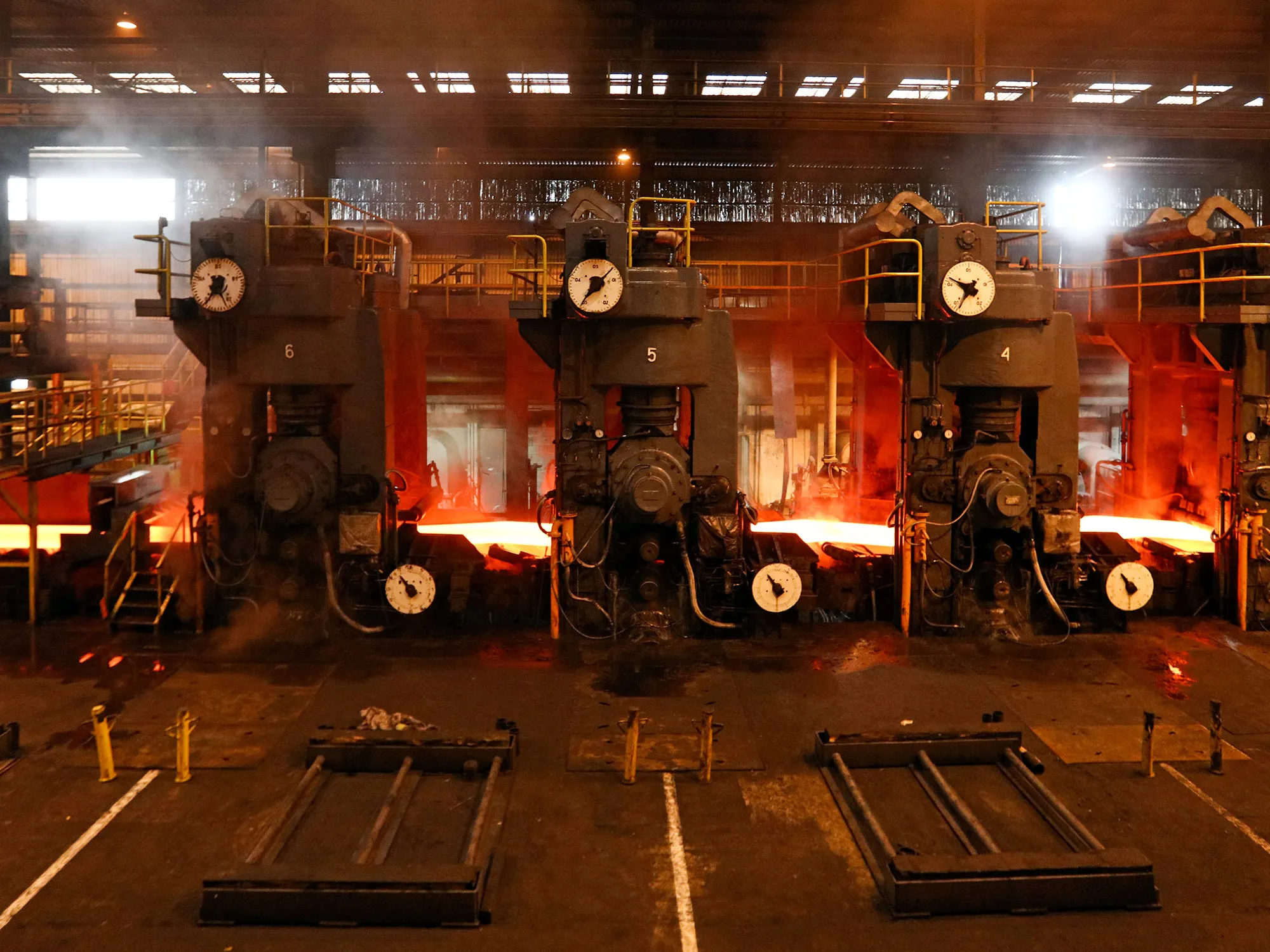 A slab of steel passes through the rolled coil finishing mill in Newport, U.K.
