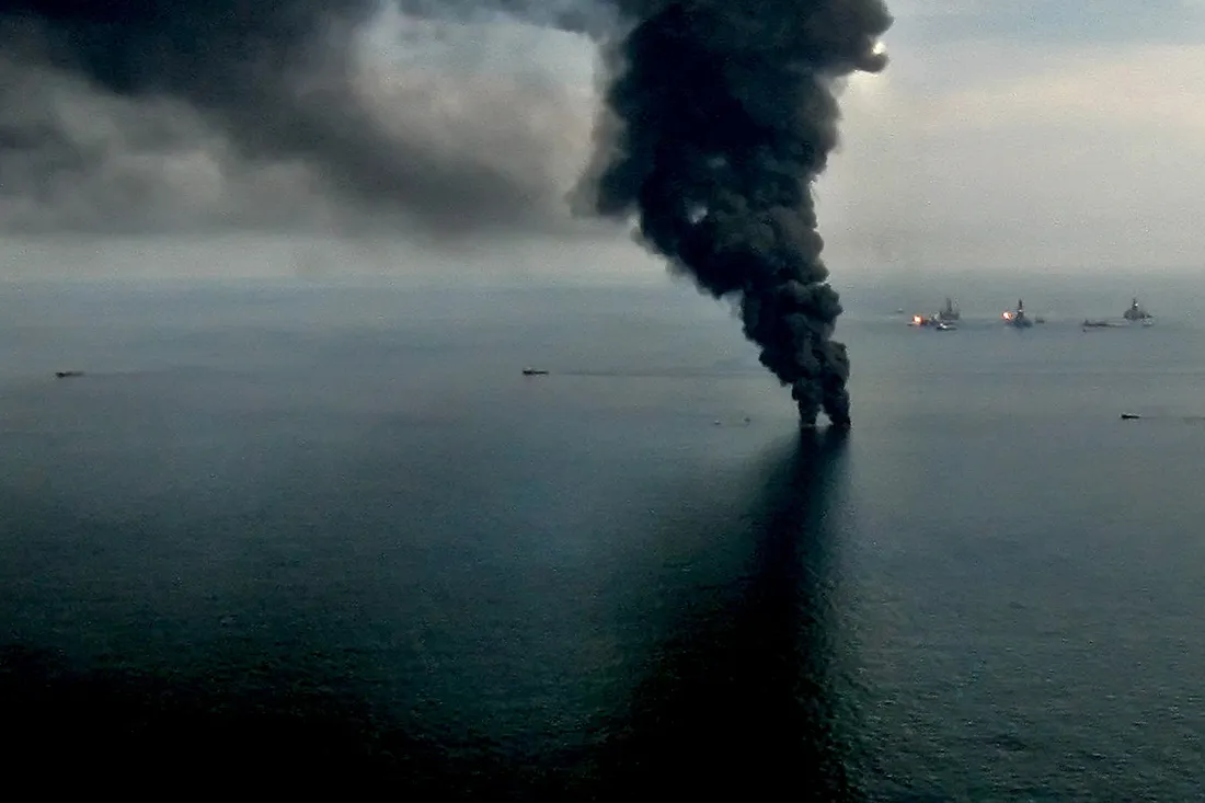 Smoke billows from controlled oil burns near the site of the Deepwater Horizon oil spill in the Gulf of Mexico off the coast of Louisiana, on June 19, 2010.
