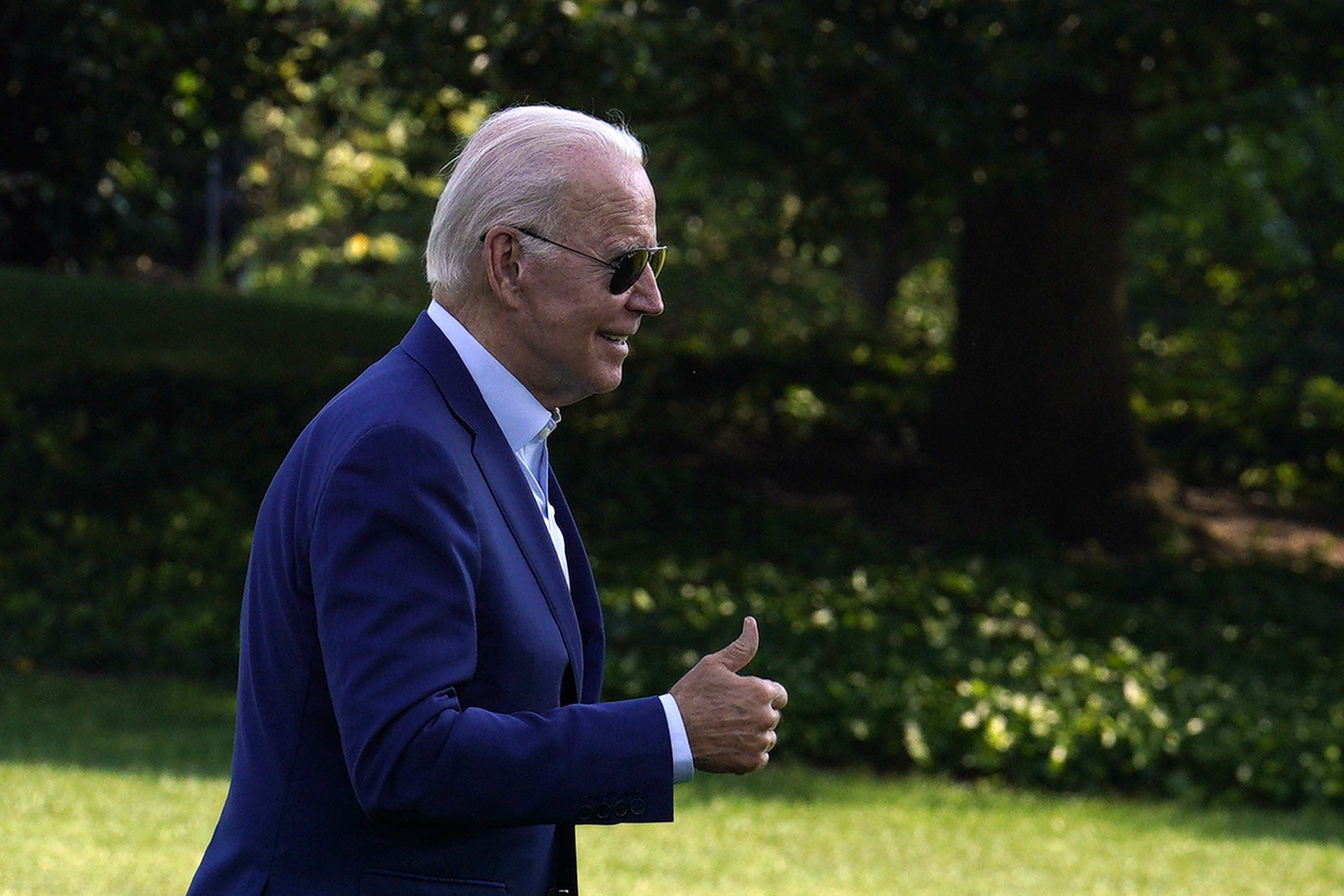 US President Joe Biden gives a thumbs up on the South Lawn of the White House after arriving on Marine One in Washington, D.C.