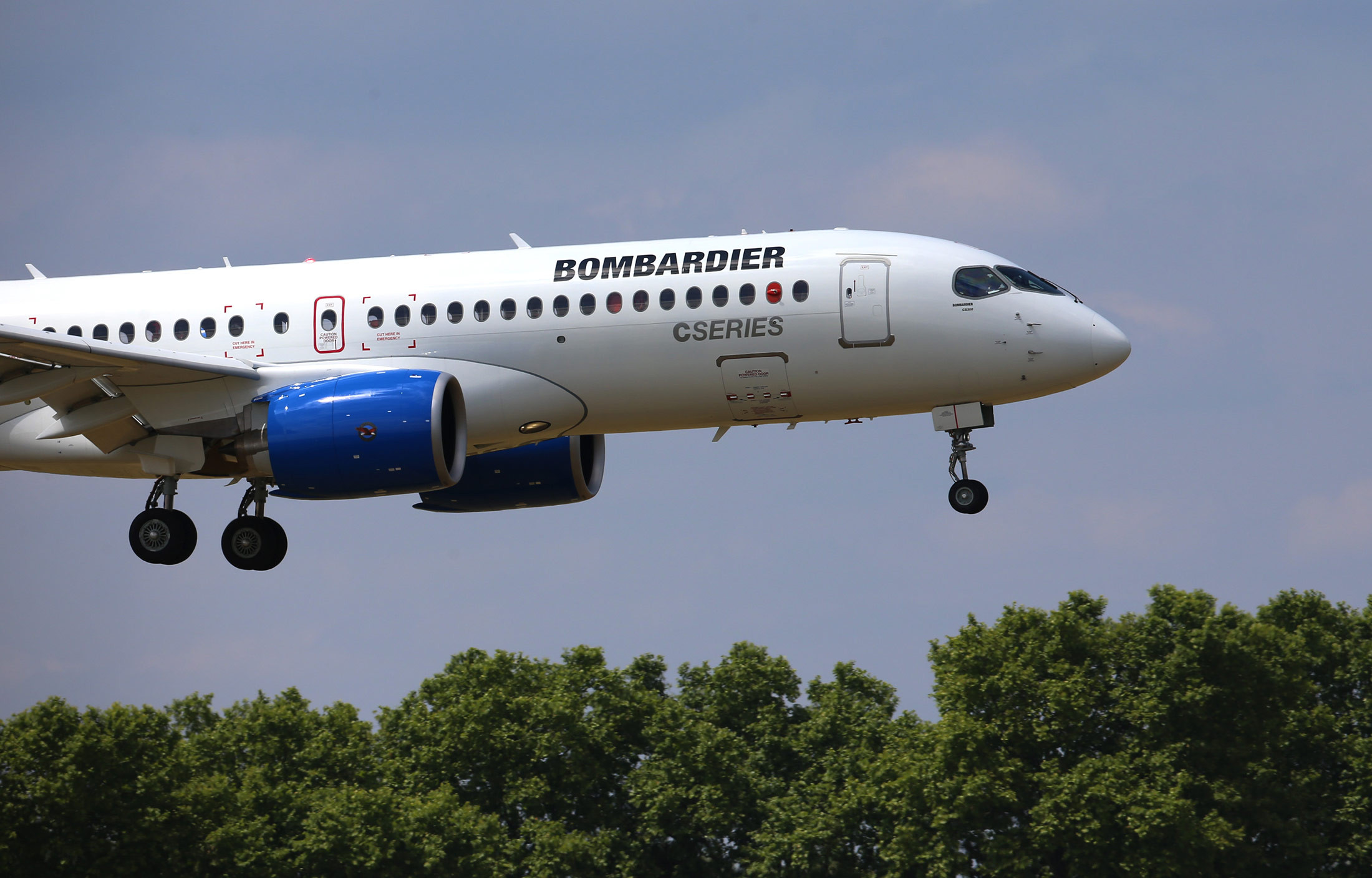 A Bombardier CS300 C Series aircraft, manufactured by Bombardier Inc., lands after a flying display on day two of the 51st International Paris Air Show in Paris, France, on Tuesday, June 16, 2015. The 51st International Paris Air Show is the world's largest aviation and space industry exhibition and takes place at Le Bourget airport June 15 - 21.