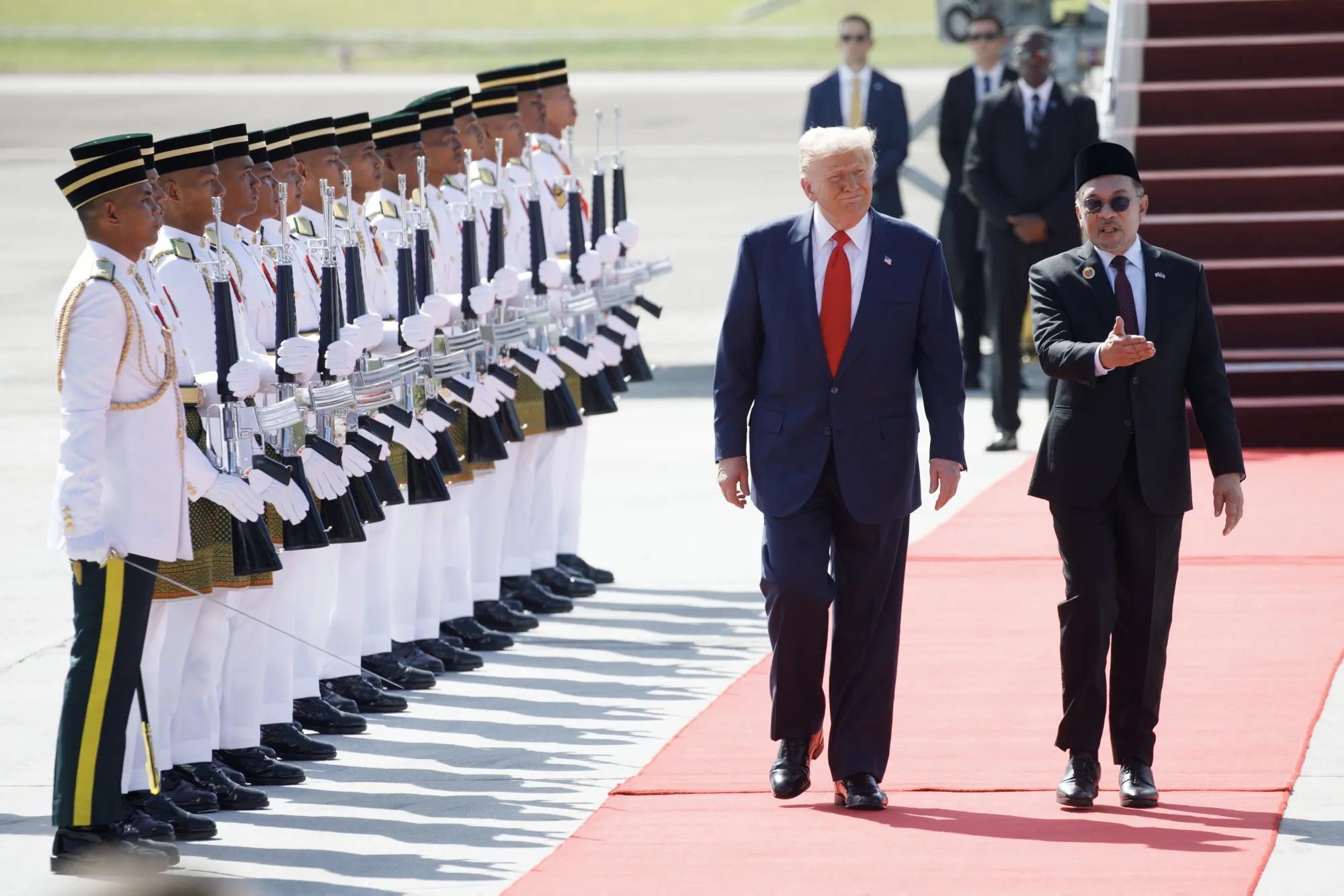 President Donald Trump, center, speaks with Anwar Ibrahim, Malaysia's prime minister, after arriving at Kuala Lumpur International Airport in Sepang,&nbsp;Malaysia, on&nbsp;Oct. 26.