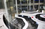 Employees work at the Tokyo Stock Exchange (TSE), operated by Japan Exchange Group Inc. (JPX), in Tokyo, Japan.