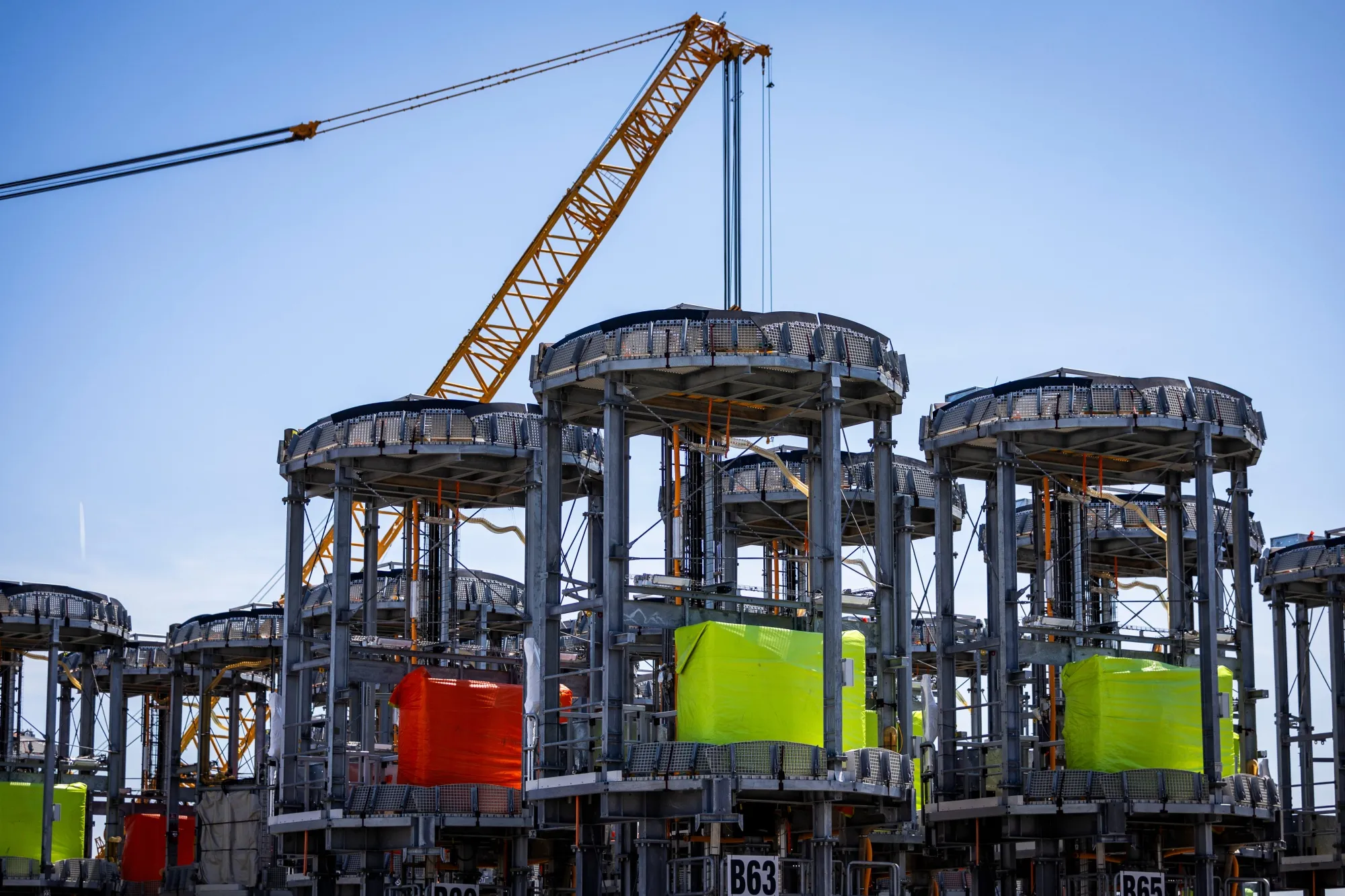 Wind turbine foundation components at the Revolution Wind construction hub at the Port of Providence in Rhode Island.