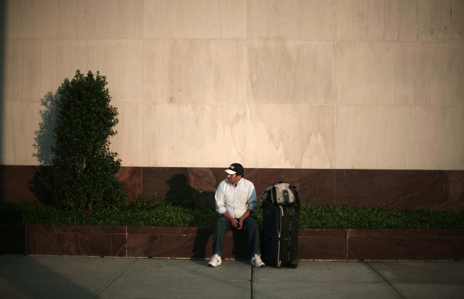 A man waits at a bus station in New Orleans.