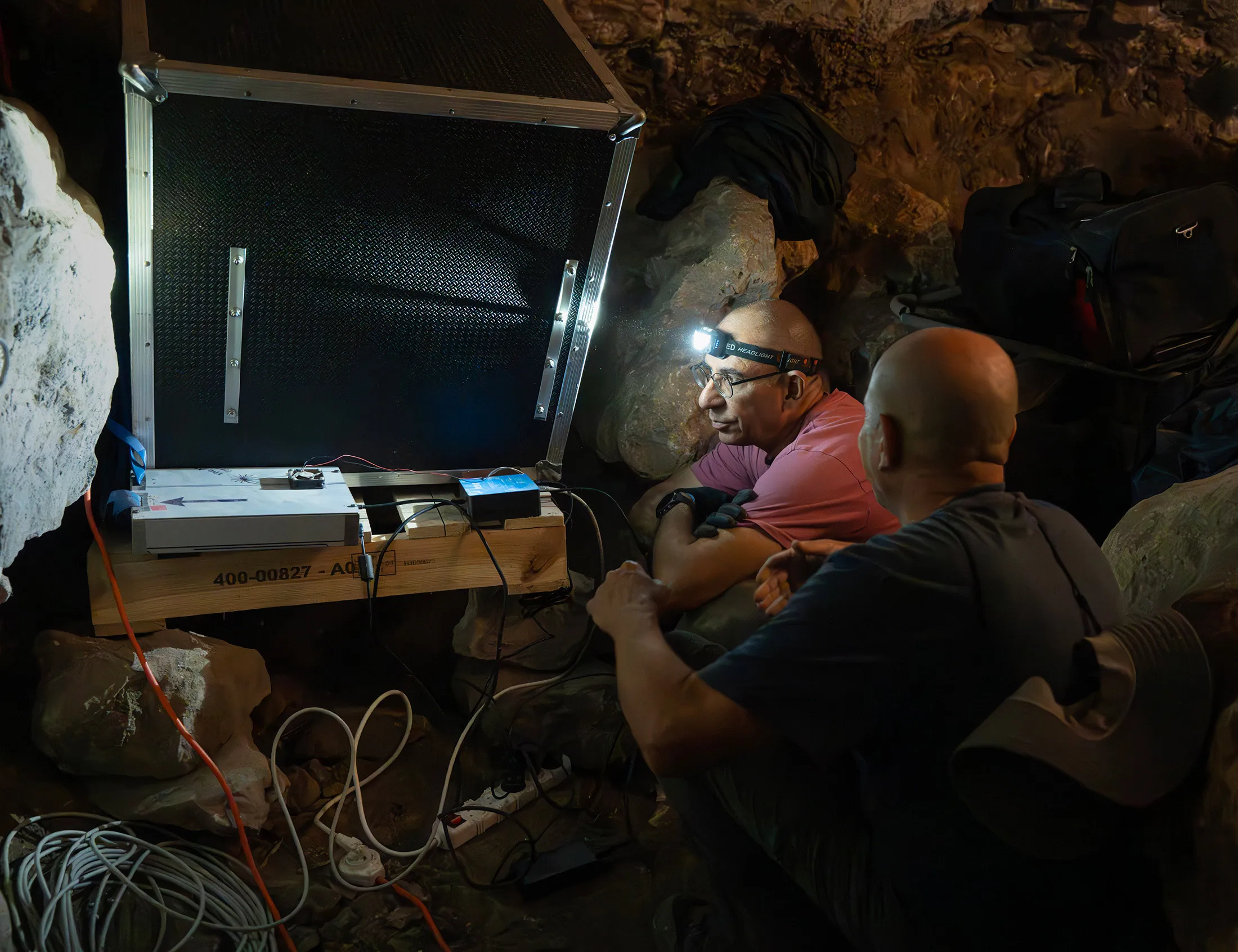 Yan Benhammou (left) and Erez Etzion, both professors at Tel Aviv University, working with a muon detector.