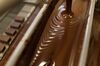 Melted chocolate is poured over scotch flavored chocolate squares in the confection kitchen.