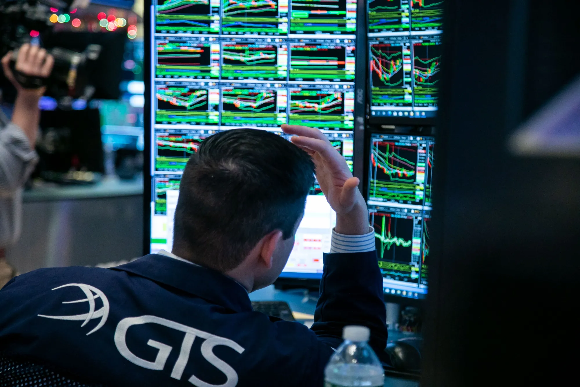 A trader works on the floor of the New York Stock Exchange in New York.