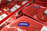 A USDA Choice sticker appears on a package of beef on displa