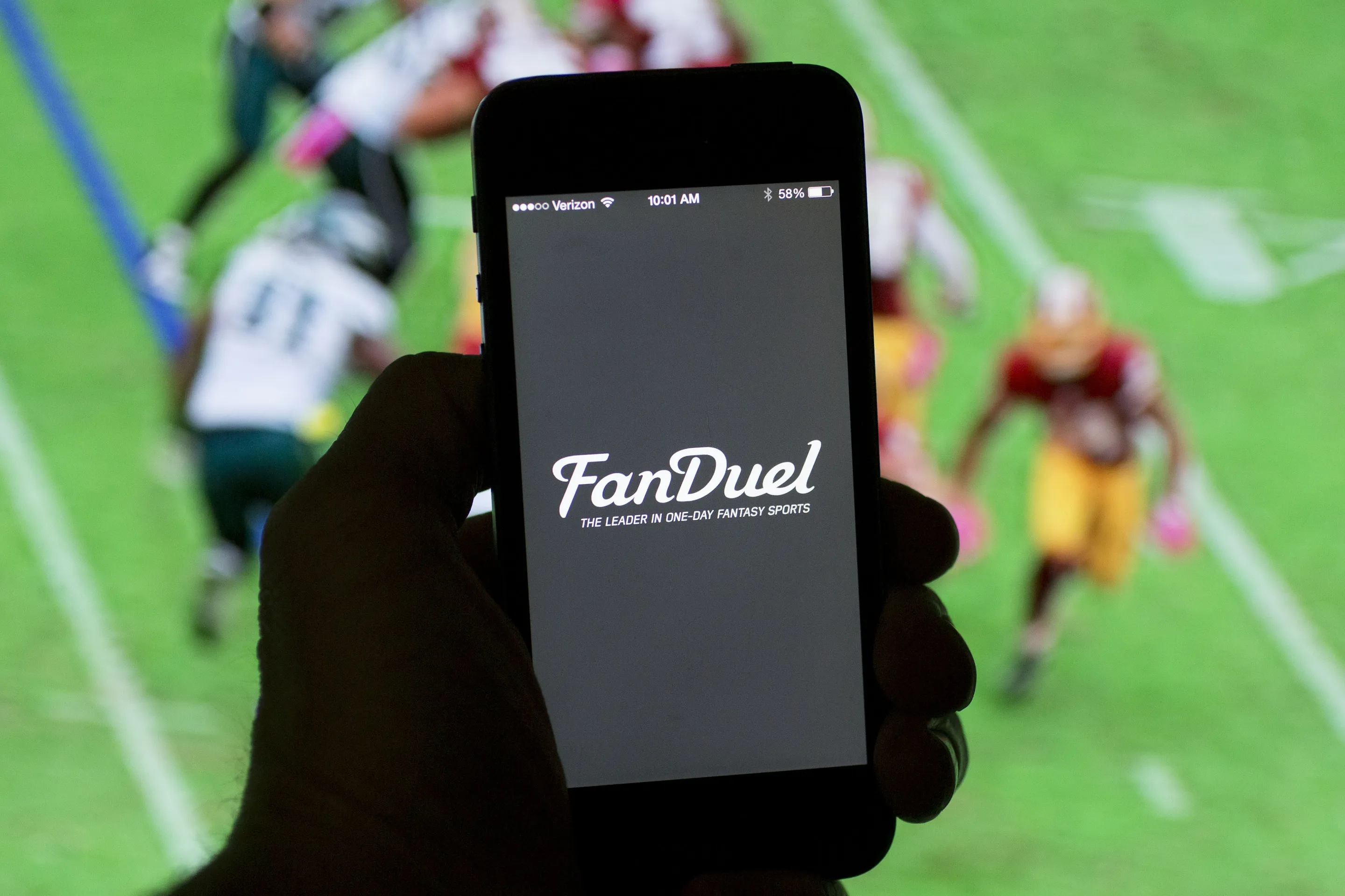 The FanDuel logo on an iPhone.