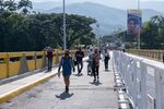 Venezuelans cross the Simon Bolivar International Bridge near the Venezuelan border in Cucuta, Colombia, on Oct. 7. 