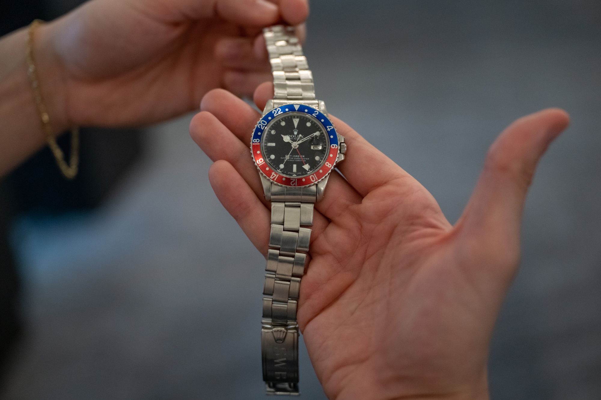 NEW YORK, NEW YORK - NOVEMBER 30: A Rolex, Reference 1675 GMT-Master 'Pepsi' owned by Hollywood Stuntman Stan Barrett, is on display during a press preview at Sotheby's on November 30, 2022 in New York City. The watch was gifted to him by actor Paul Newman, and the back is engraved with, "Stan Barrett, 739 MPH, Mach 1.0106, 12-17-79". It is expected to be auctioned for $$50,000 100,000. (Photo by Alexi Rosenfeld/Getty Images)