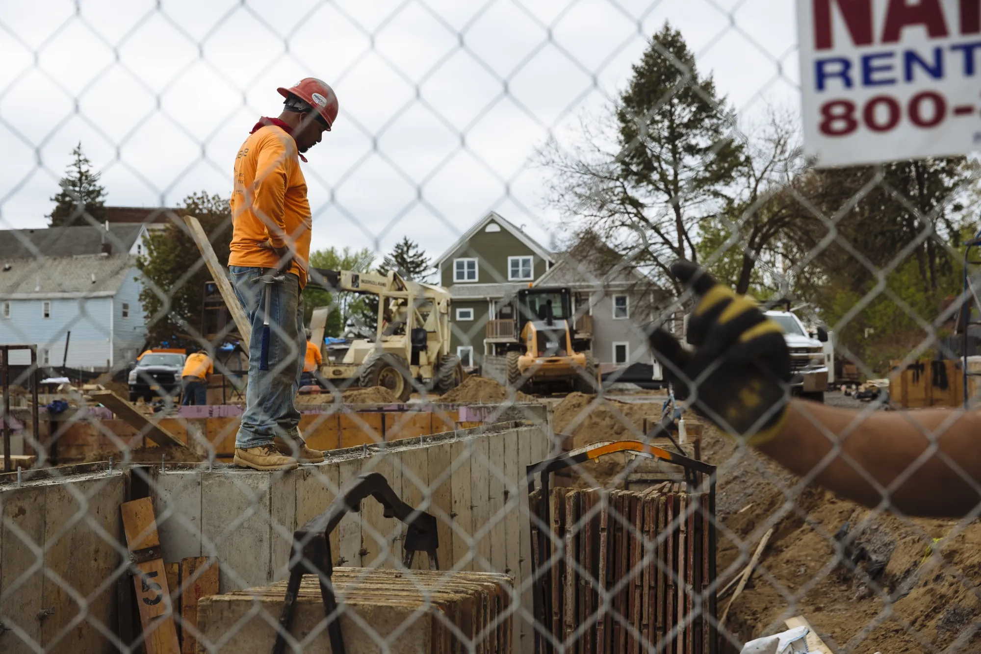A worker stands at a housing construction site in Schenectady, New York, on May 15.