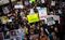 People march in the National March Against Police Violence, which was organized by National Action Network, through the streets of Manhattan on December 13, 2014 in New York City.