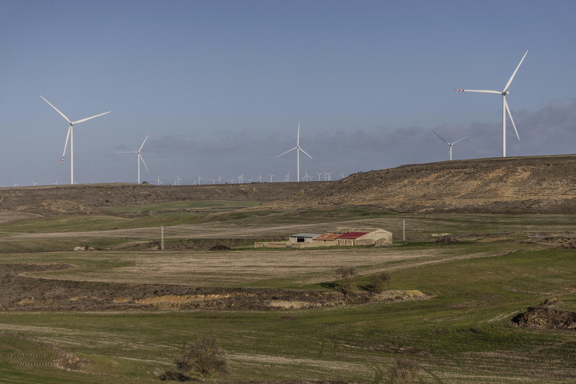Wind turbines dot the landscape around Huesca, Aragón. Renewables accounted for nearly 90% of the electricity generated in the region last year. Photographer: Ángel García/Bloomberg