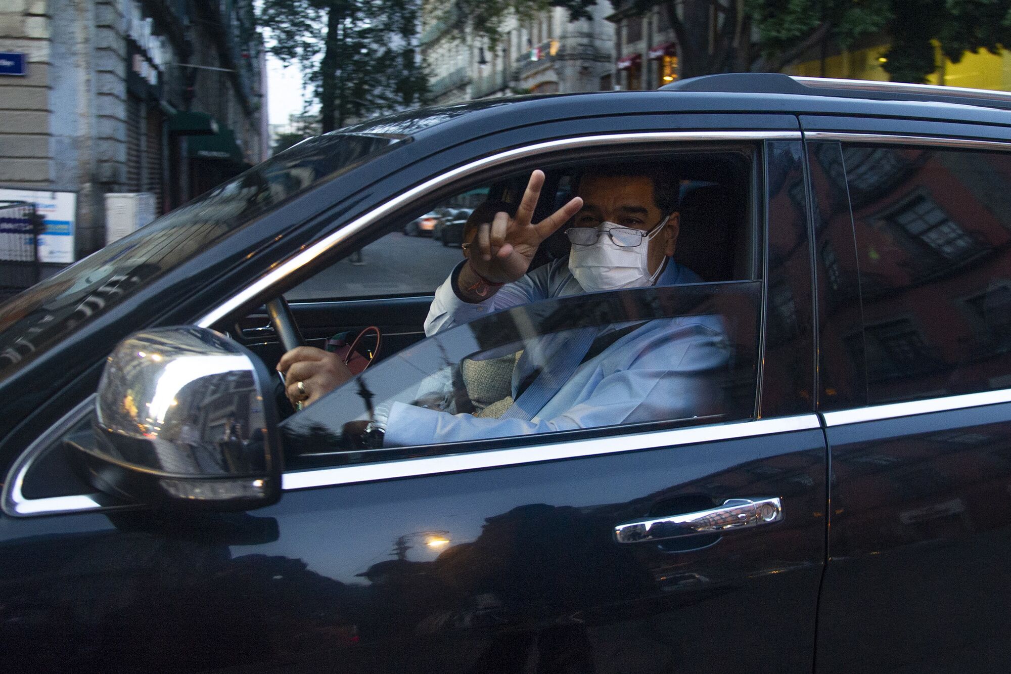 Nicolas Maduro drives a car to the National Palace to participate in the Sixth Summit of the Community of Latin American and Caribbean States in Mexico City on Sept. 18, 2021. 