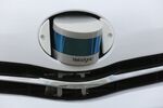 A Velodyne Lidar puck sensor sits in the bonnet of a self-driving car.