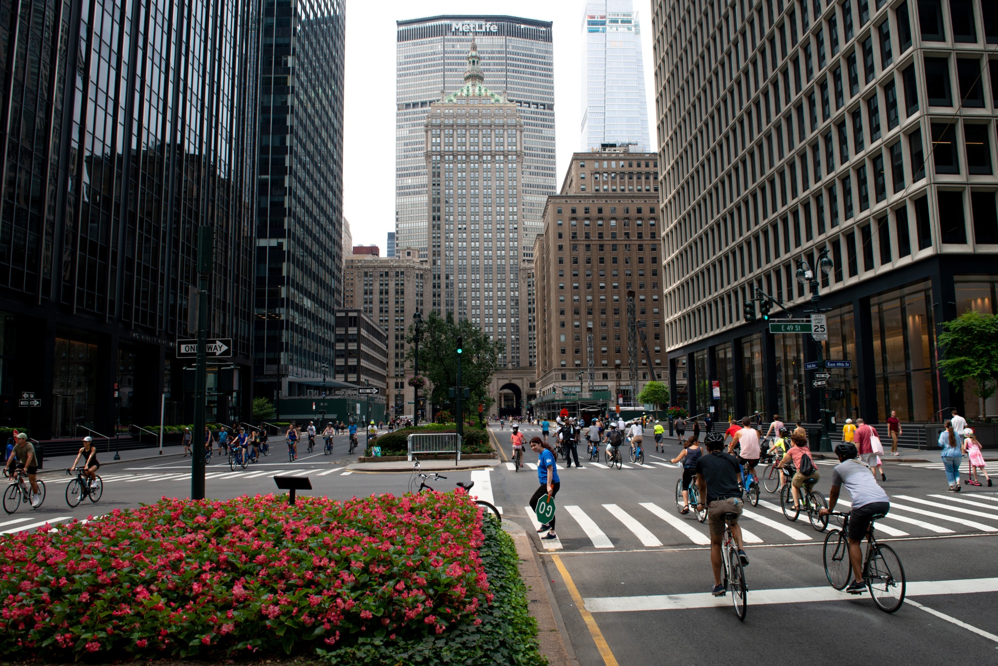 People walk and ride bicycles along Park Avenue on Aug. 7, 2021 as part of the New York City Department of Transportation’s Summer Streets event. The planted medians that divide the iconic avenue are slated for a major renovation. 