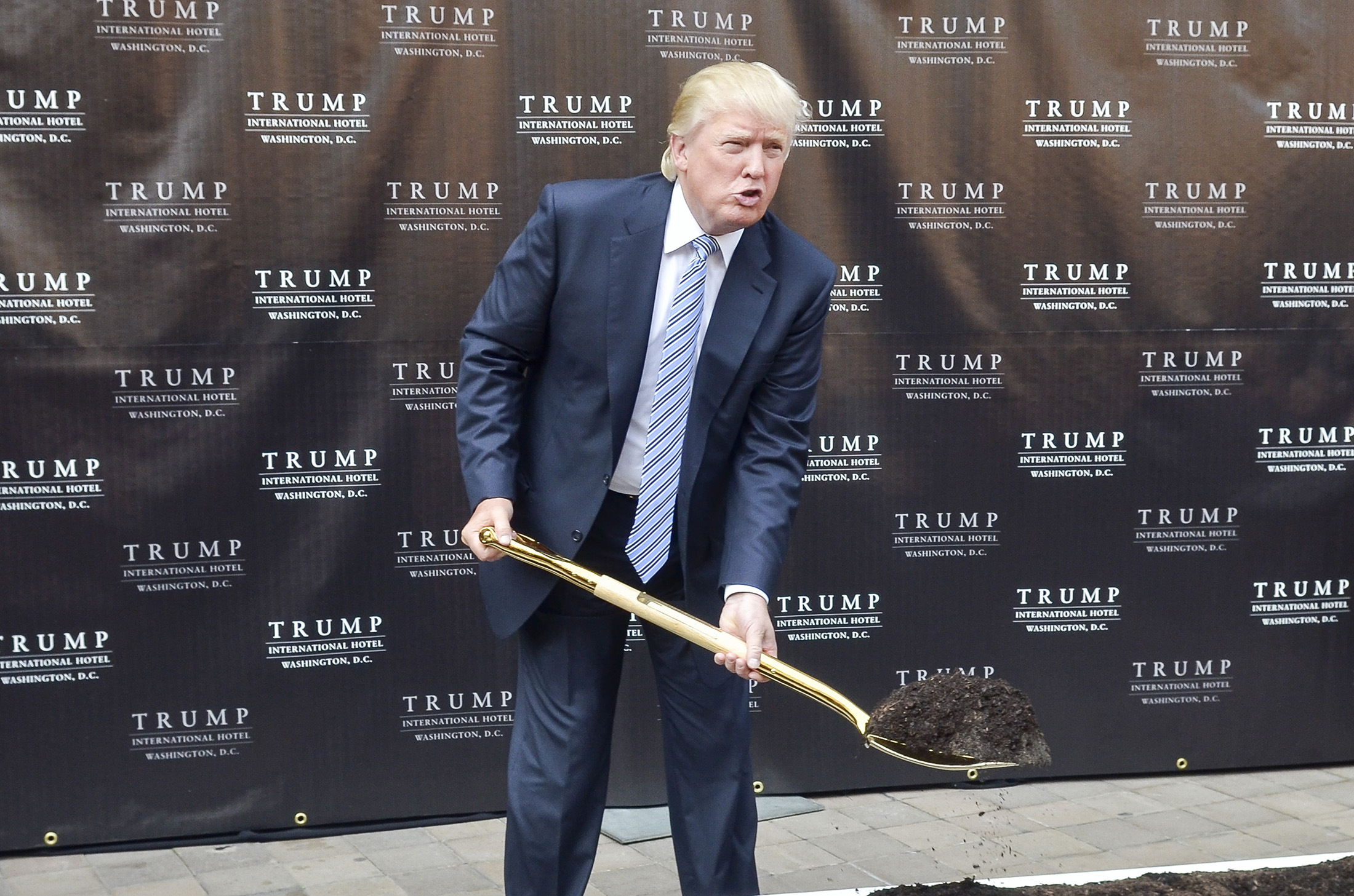 Donald Trump attends the Trump International Hotel Washington groundbreaking ceremony in 2014.