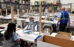 Workers count and verify mail ballots at the Clark County Election Department in North Las Vegas, Nevada on June 9.