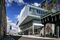 The exterior of the Whitney Museum of American Art. Sandwiched between the West Side Highway and a busy neighborhood, noise filters through the glass as a general din.