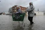 A family tries to reach a grocery store in Crisfield, Maryland, after a storm in 2008.