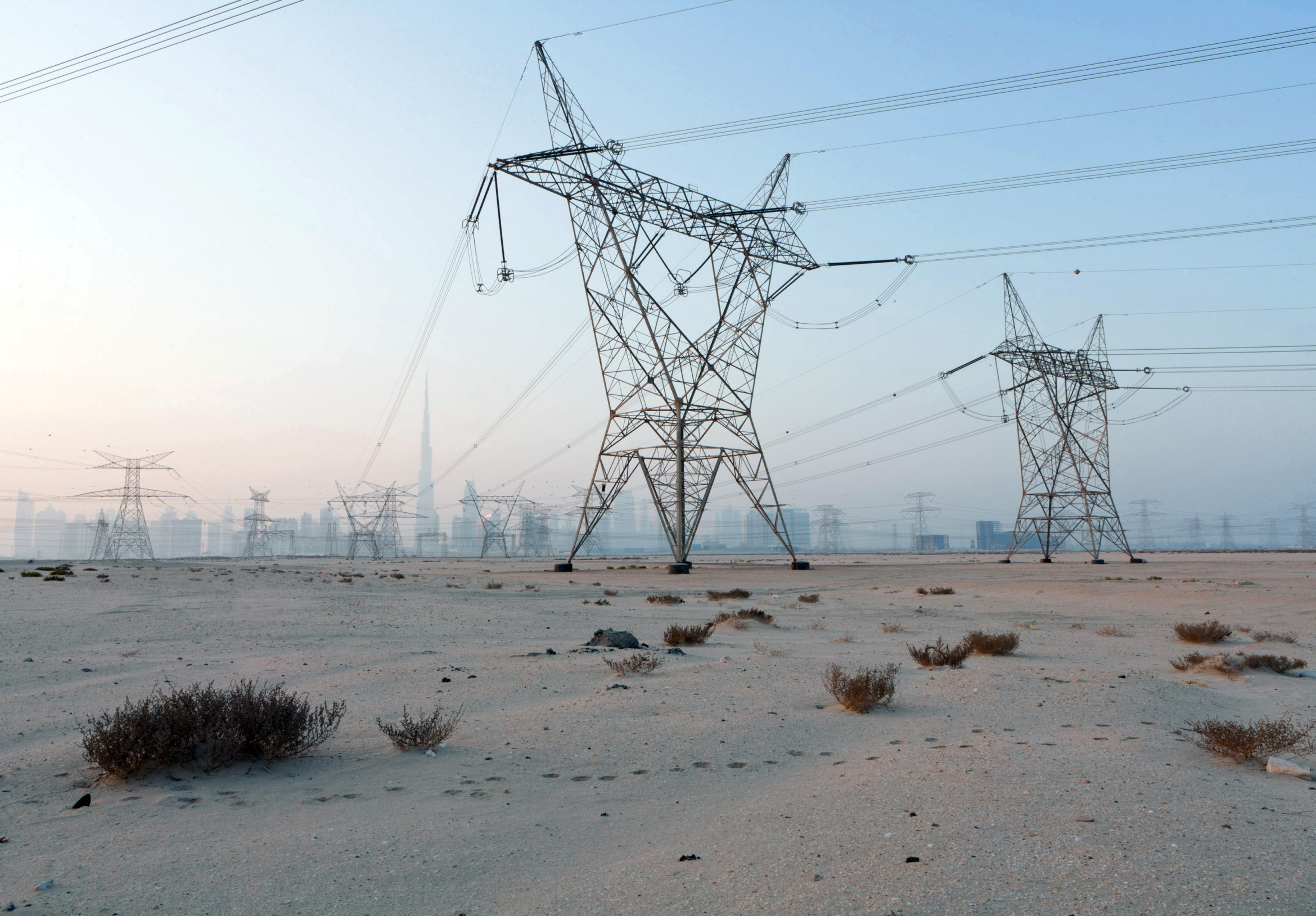 Electricity power lines operated by Dubai Electricity and Water Authority,&nbsp;in the desert near Dubai, United Arab Emirates.