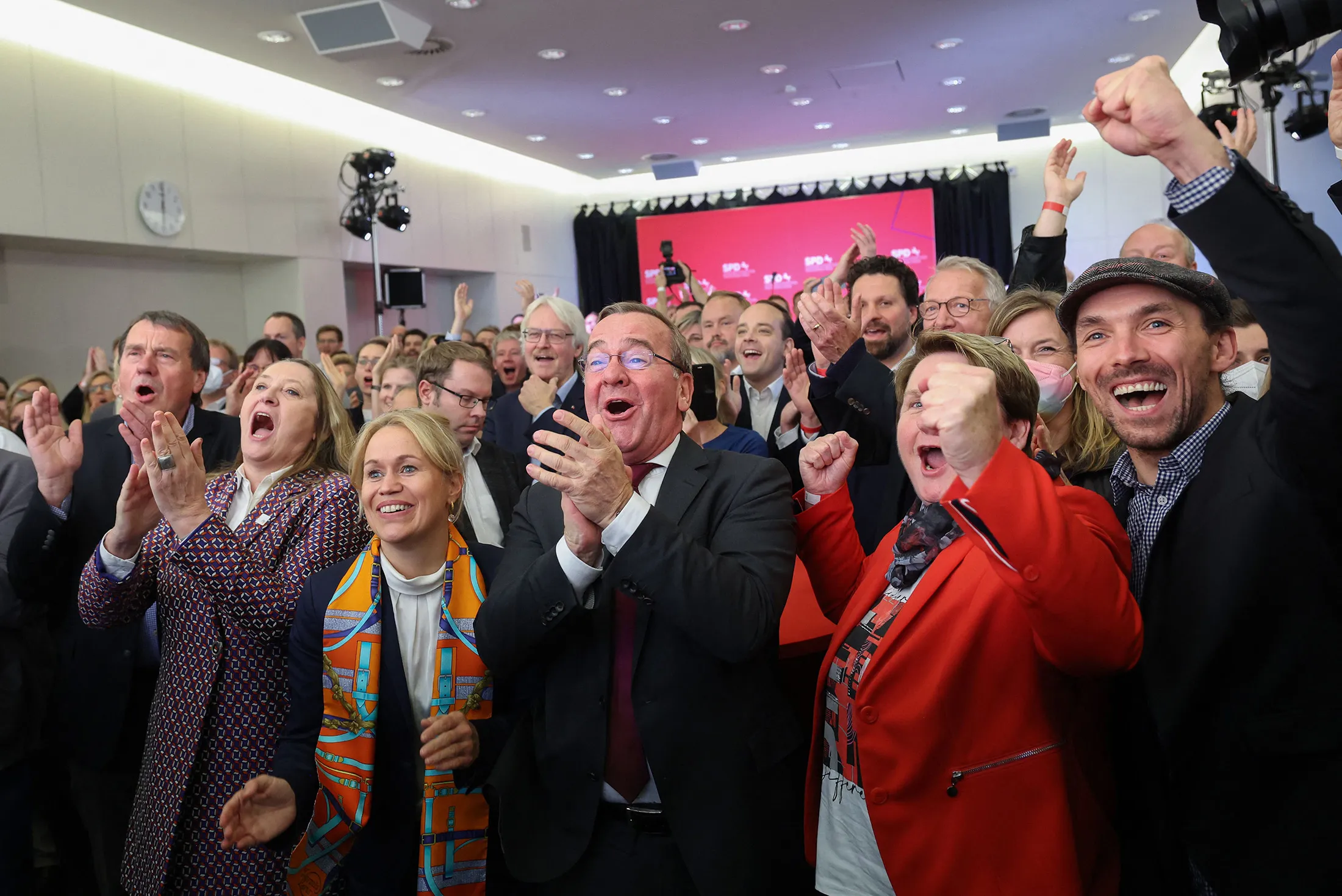Boris Pistorius, Lower Saxony Interior Minister of the Social Democratic Party (SPD), center, and supporters react after exit polls were announced on in Hanover,&nbsp;Germany on Oct.&nbsp;9.