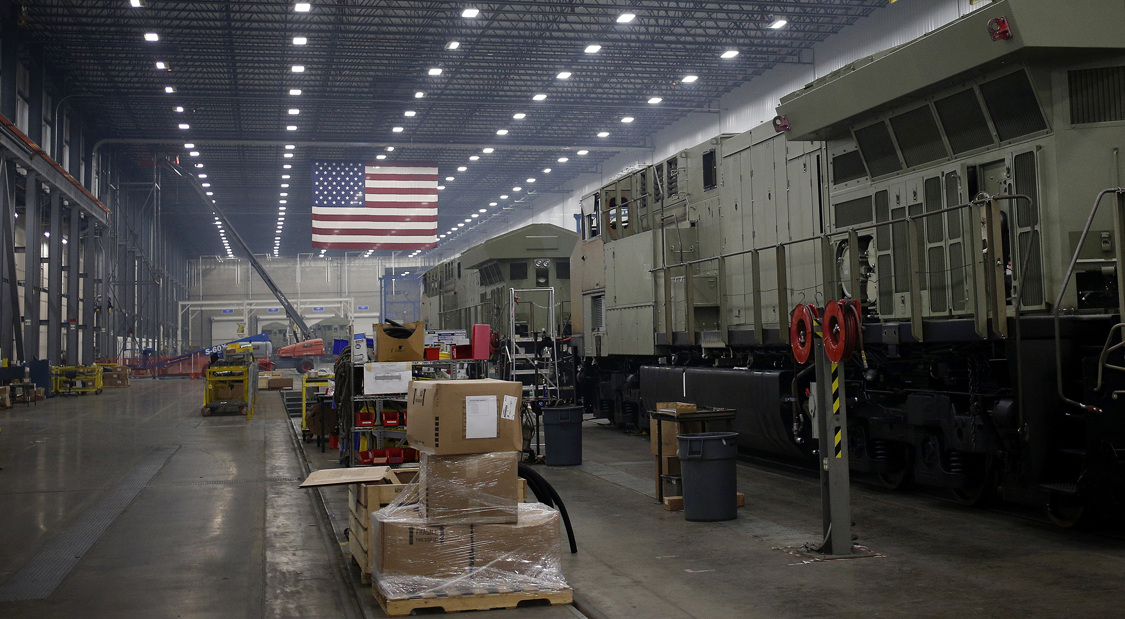 An American flag hangs above an assembly line in Fort Worth, Texas.