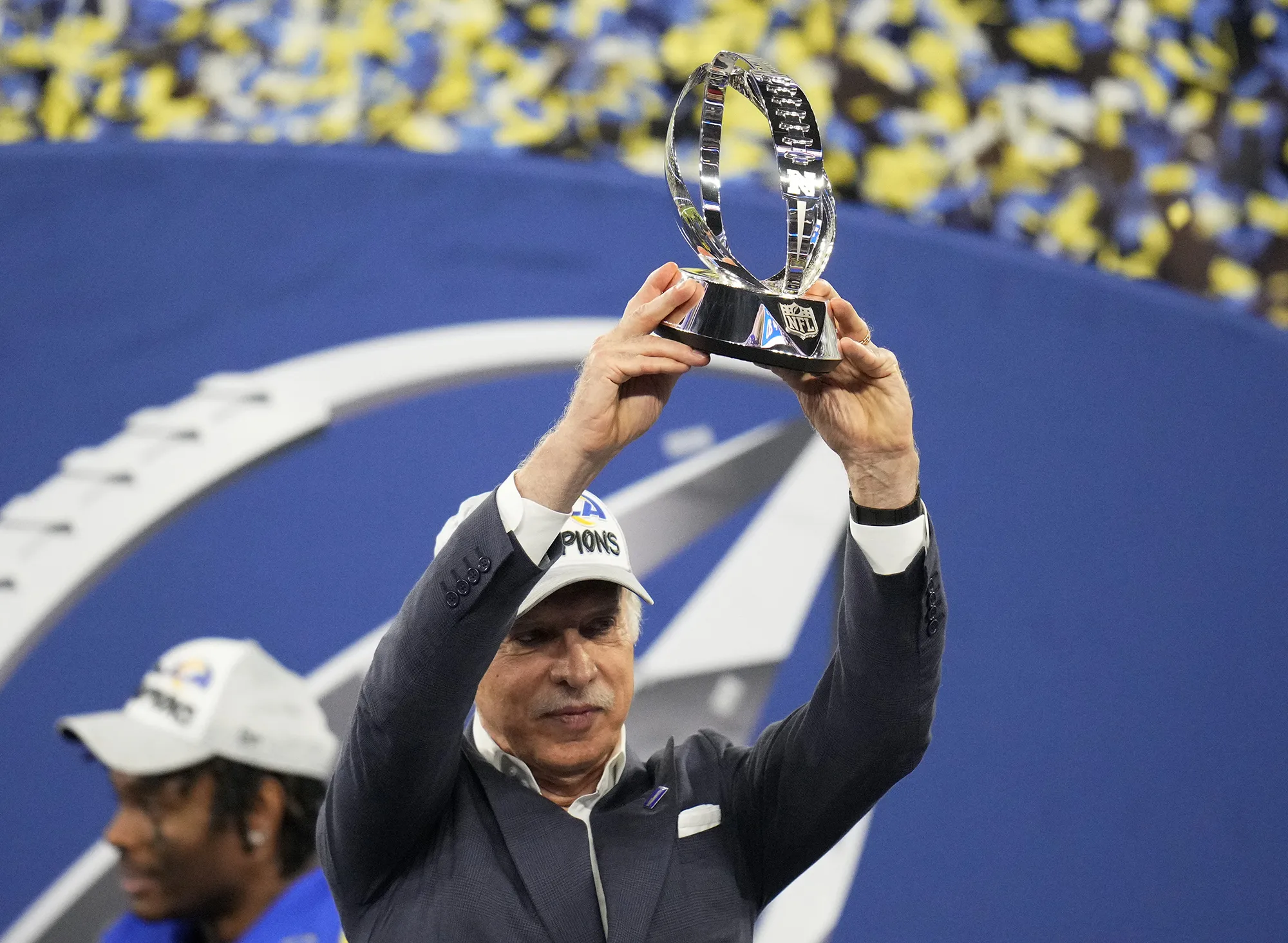 Stan Kroenke raises the trophy after the Rams win over the San Francisco 49ers in a NFC championship game at SoFi Stadium in Inglewood, California on Jan. 30.