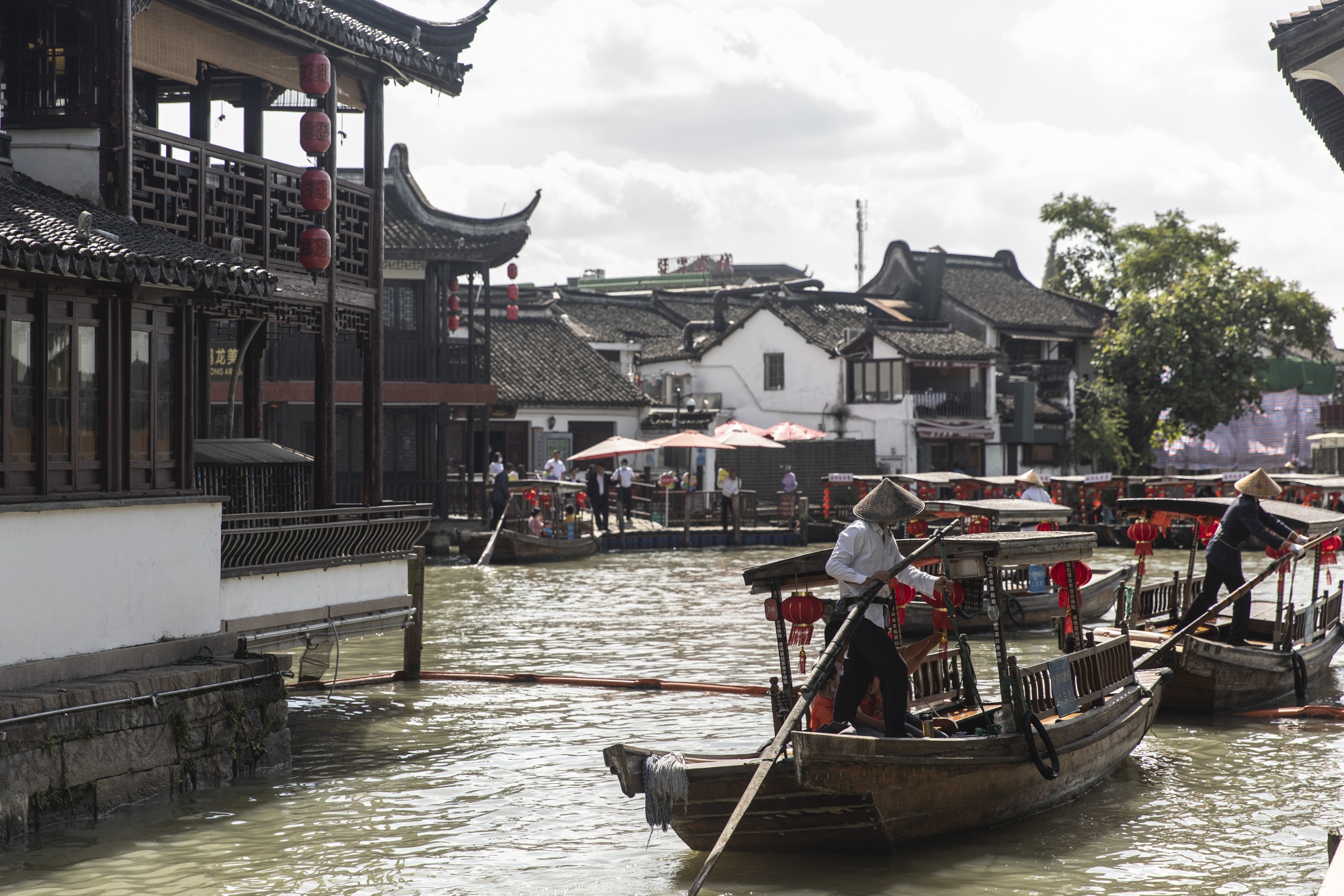 Boats navigate the canals of the Zhujiajiao water village in Qingpu.