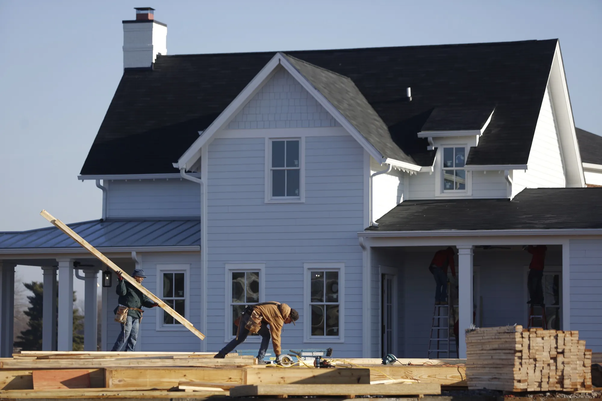 Contractors work on a home in Louisville, Kentucky.