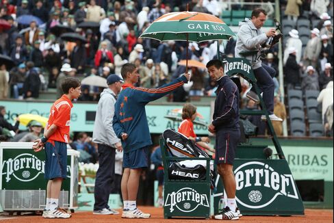 French Open Final Delayed by Rain as Nadal Leads Djokovic